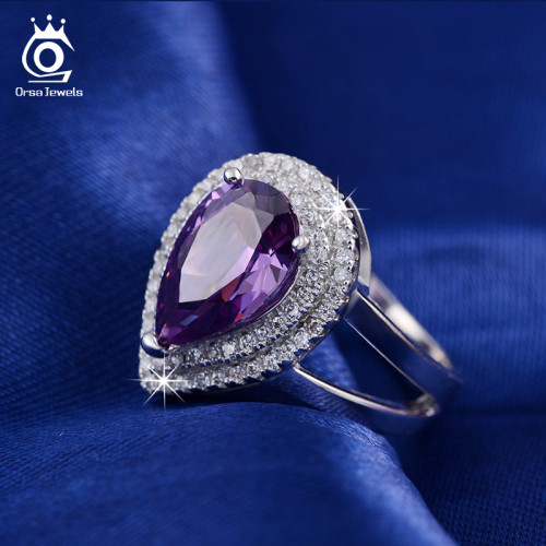 ORSA JEWELS Big Water Drop 6 ct Zircon Ring 3 Prong Setting with Micro Paved CZ Stone Around Trendy Party Ring for Women OR36