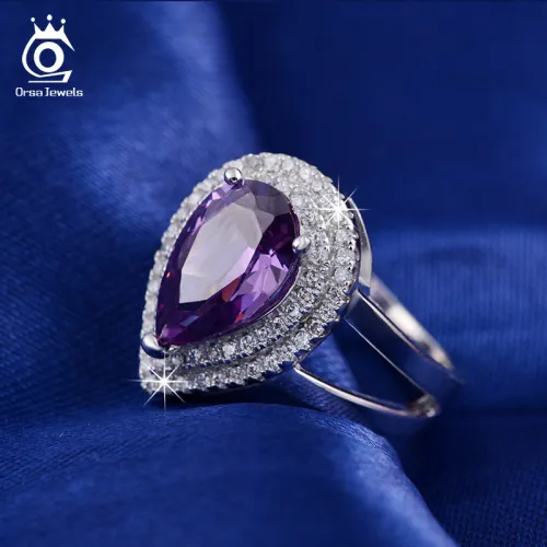 ORSA JEWELS Big Water Drop 6 ct Zircon Ring 3 Prong Setting with Micro Paved CZ Stone Around Trendy Party Ring for Women OR36